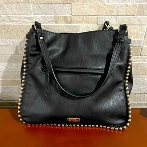 **Like new** Jessica Simpson black purse with beautiful gold details.